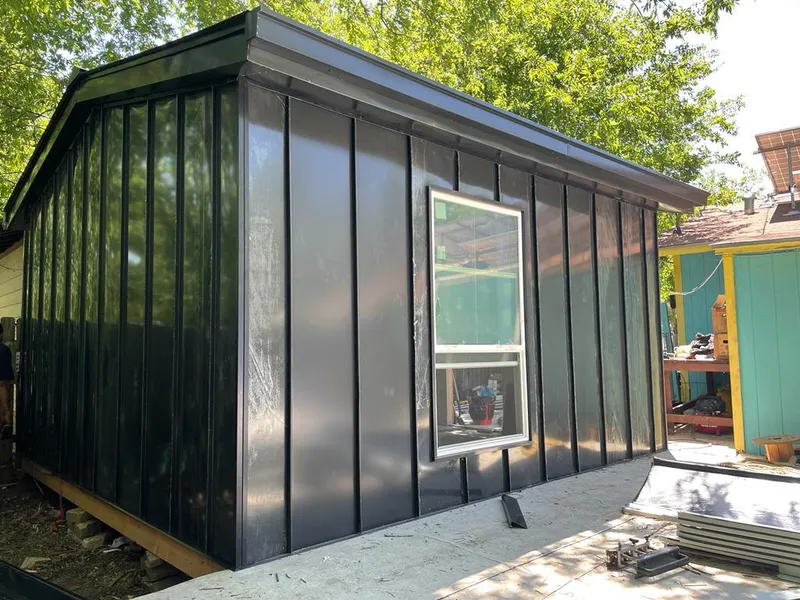 Black standing seam metal wall panels for Metal Roof Installation in Lovington