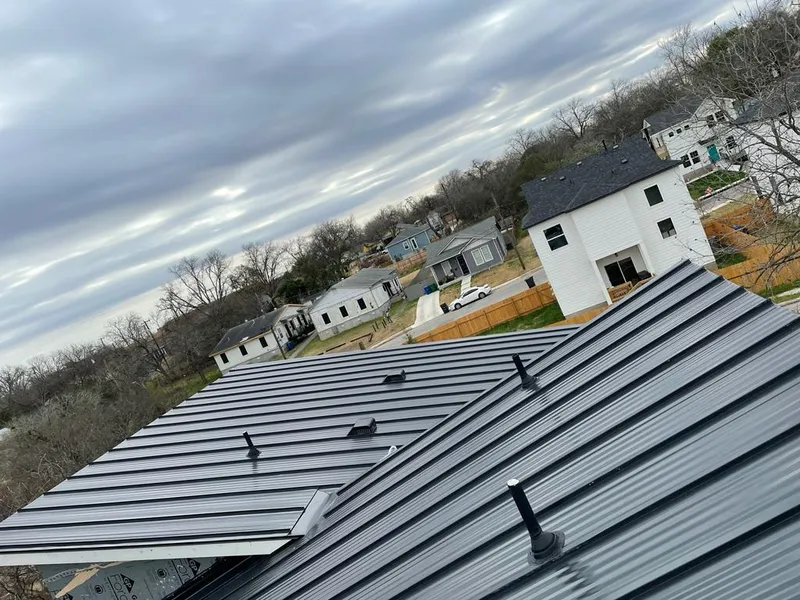 Standing seam metal roof panels with vents for Skylight Repair in Lovington